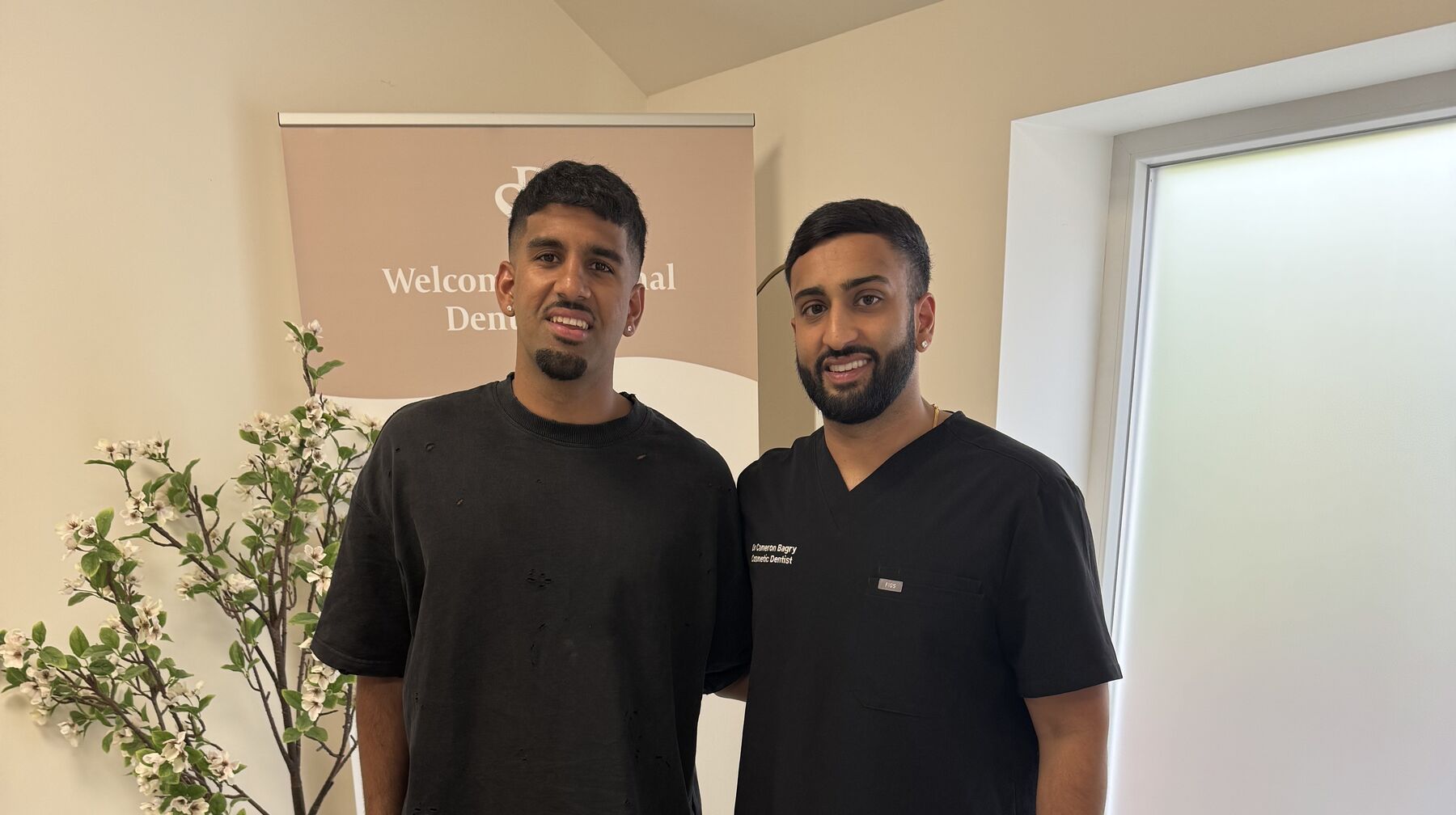 Dr Cameron Bagry with footballer Arjan Raikhy at the practice