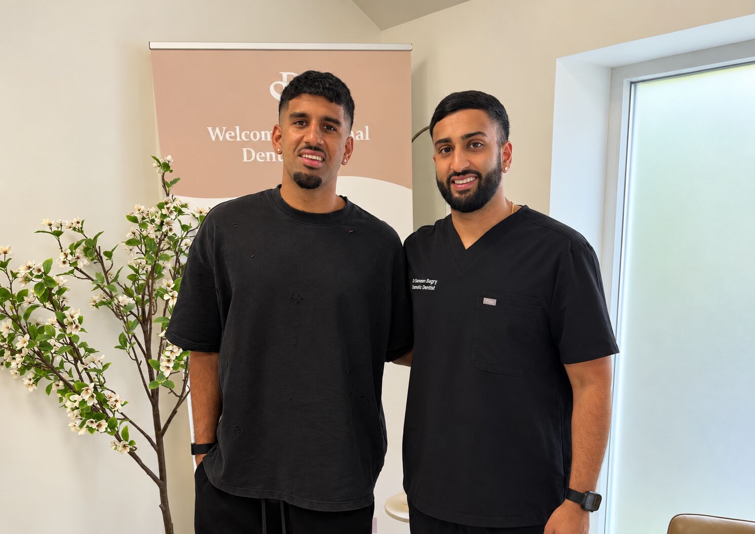 Dr Cameron Bagry with footballer Arjan Raikhy at the practice