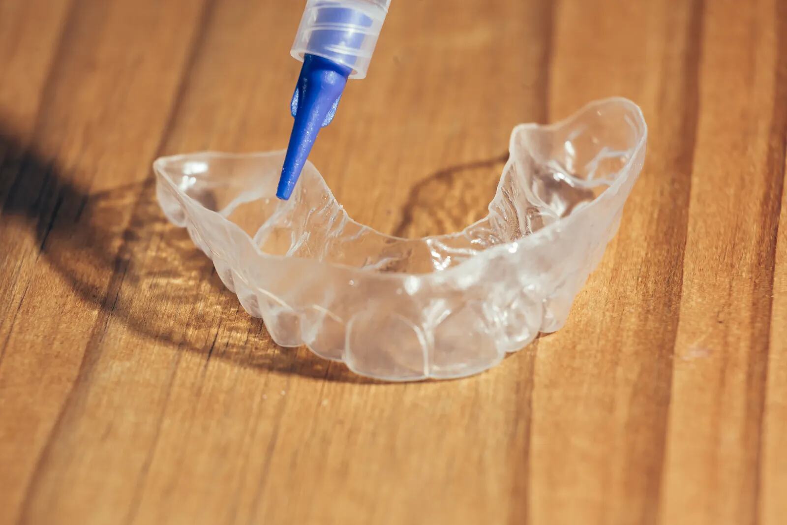 Whitening gel being applied to a clear custom tray